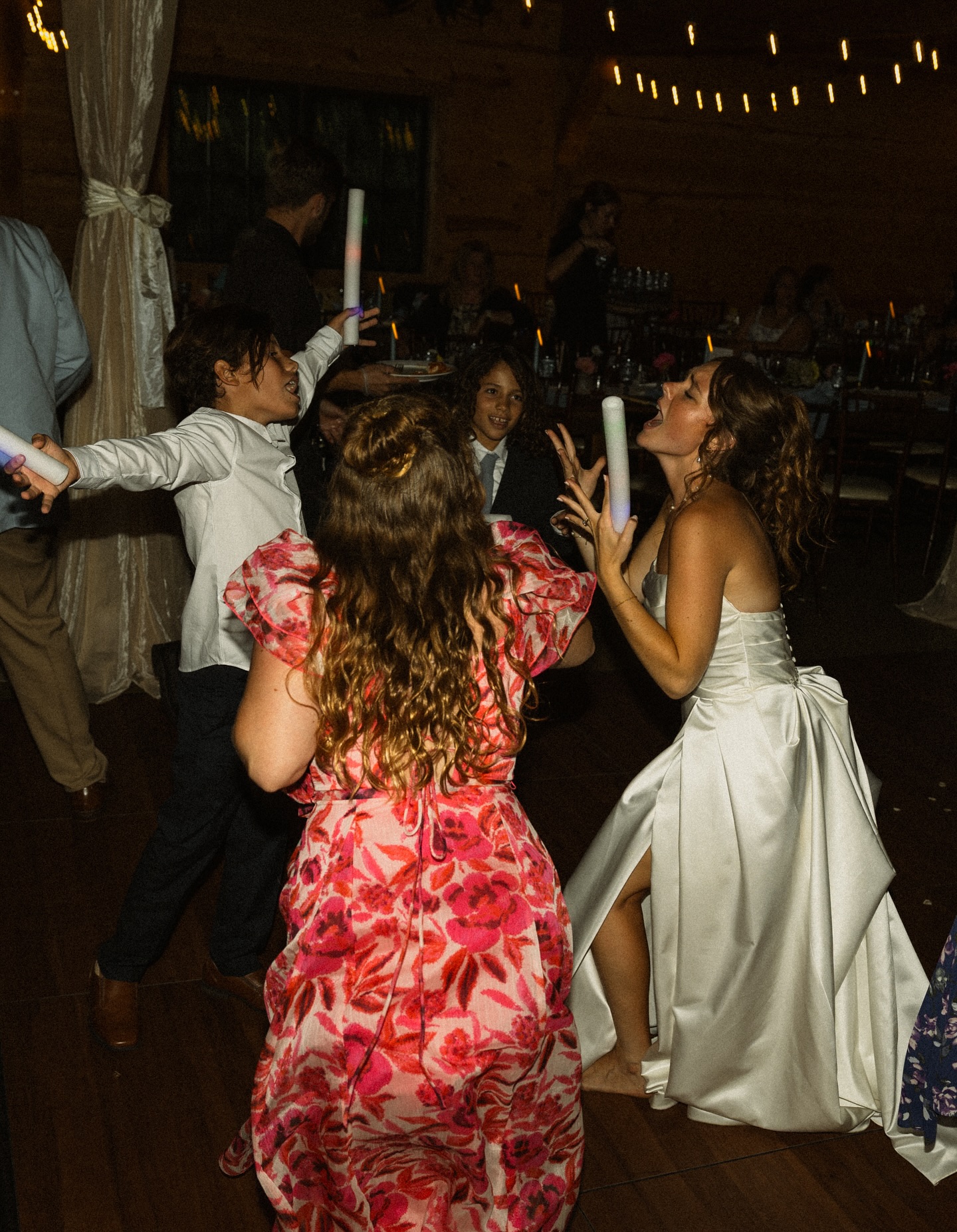 Bride singing with guests on the dance floor at The Barn at Bull Meadow